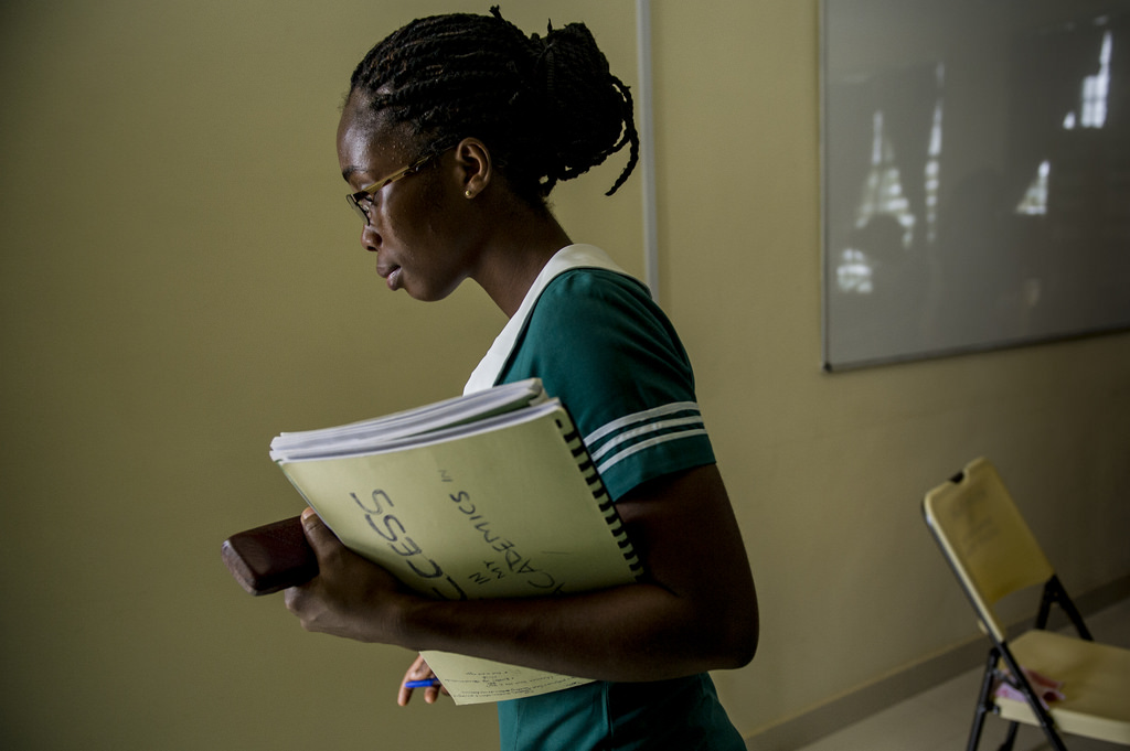 Heath Care worker carrying resources