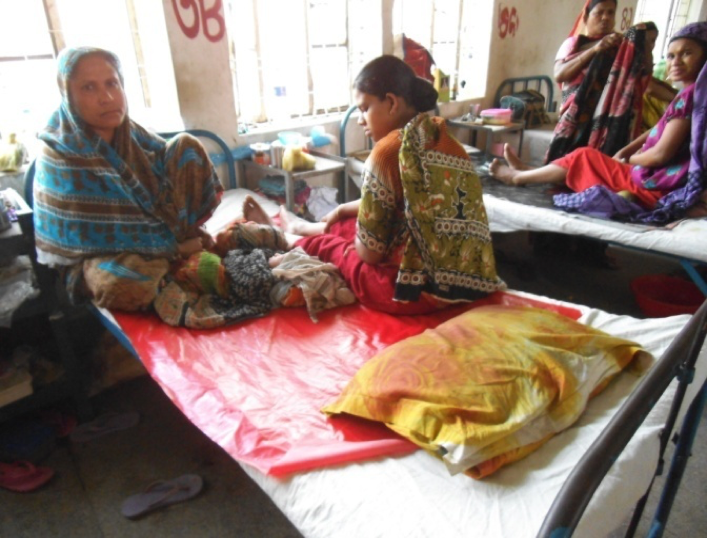 Women in hospital with their newborns