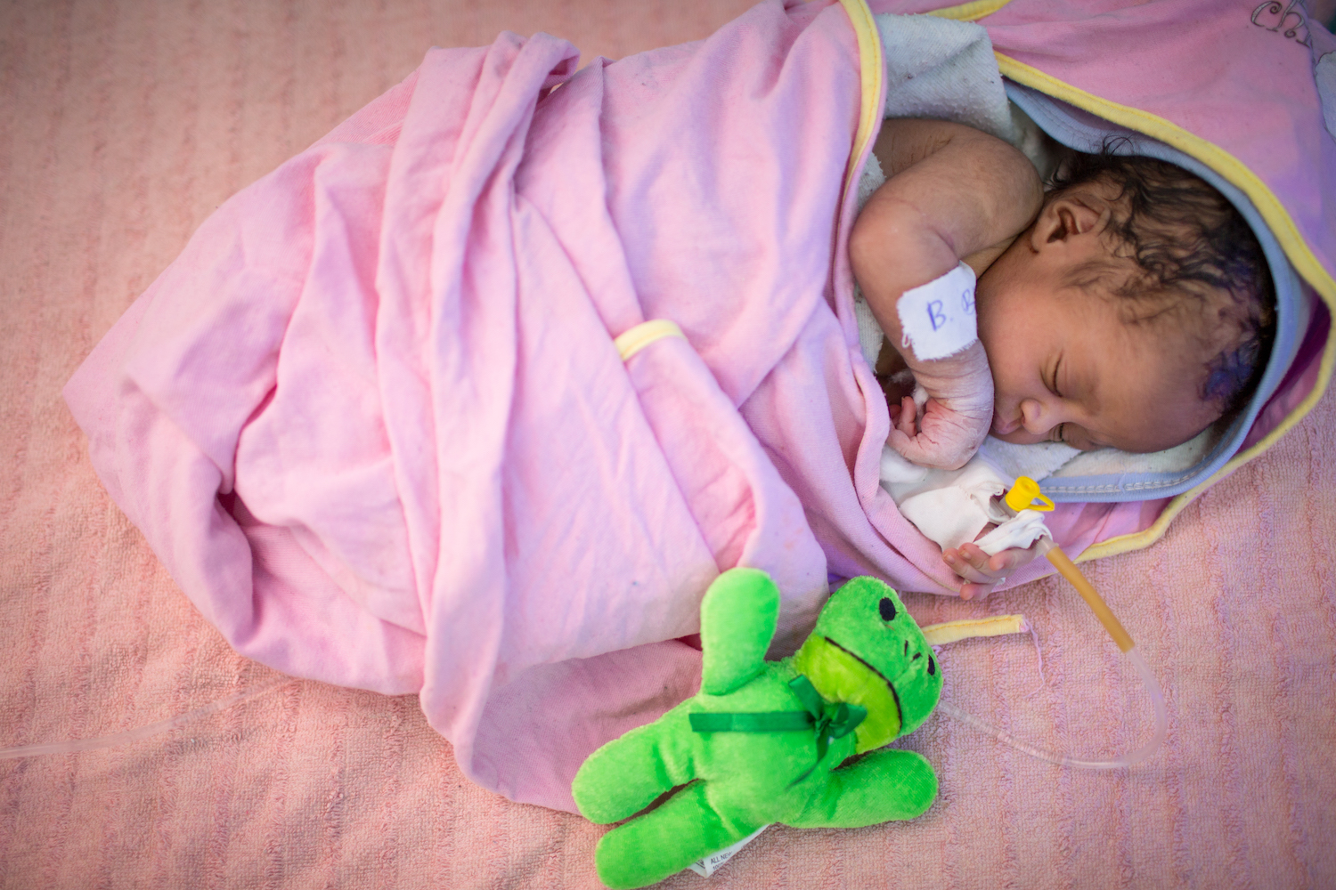 A newborn infant receives specialised care at the UNICEF